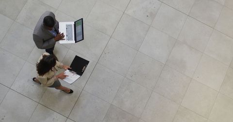 Business professionals discussing on move in modern office