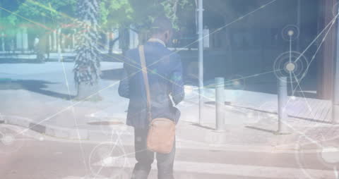 Businessman Walking with Futuristic Data Overlay