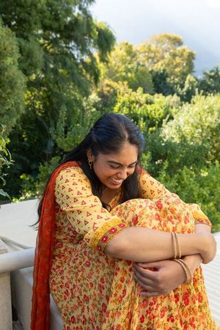 Joyful Moments in Nature: Indian Woman in Traditional Attire