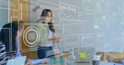 Business Team Analyzing Digital Data in Meeting