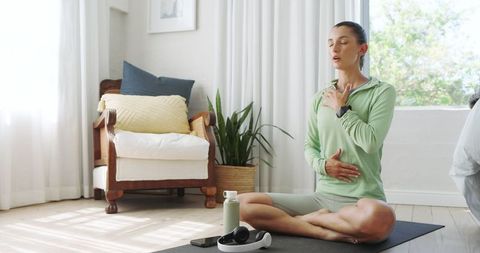 Woman Practicing Mindfulness Meditation at Home