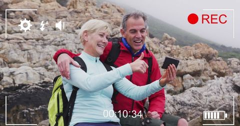 Happy Senior Couple Taking Selfie on Seaside Adventure