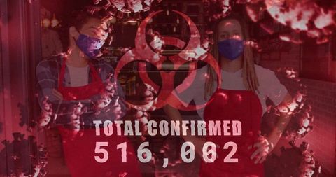 Masked retail workers in aprons standing at storefront with biohazard and case tally