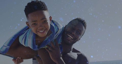 Father and Child Enjoying a Playful Beach Day