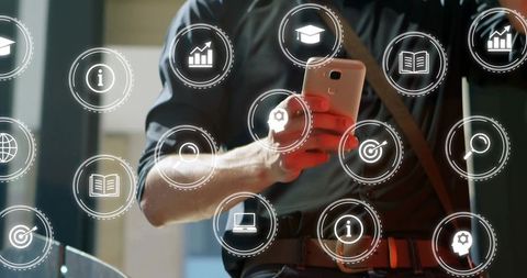 Man holding smartphone tapping floating HUD icons for data insights, productivity, office