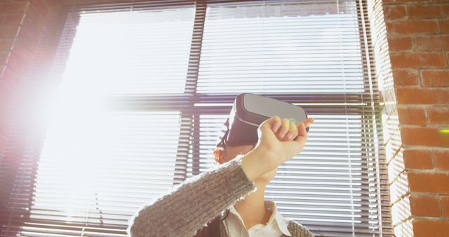 Woman Experiencing Virtual Reality in Bright Office - Download Free Stock Images Pikwizard.com