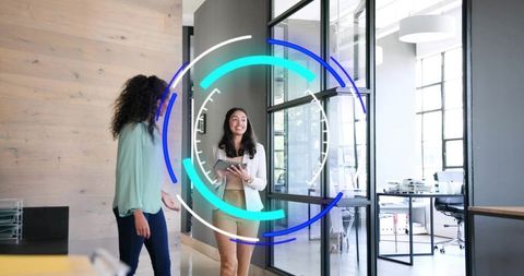 Young professional walking glass office holding tablet with circular hud overlay collaborating