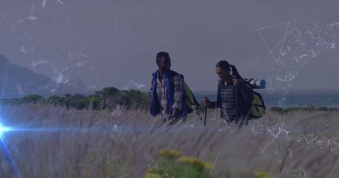 Hikers Exploring Scenic Coastal Path with Backpacks