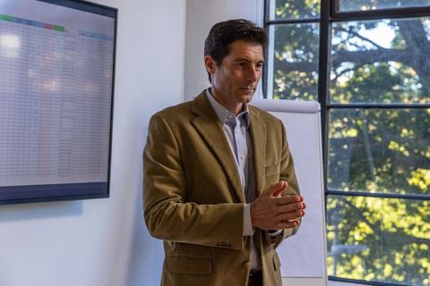 Professional man presenting business strategy in office