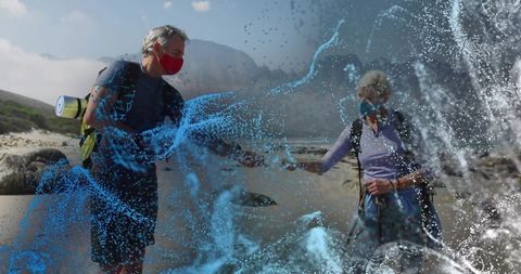 Senior Hikers with Masks on Rocky Seaside with Digital Water Effect