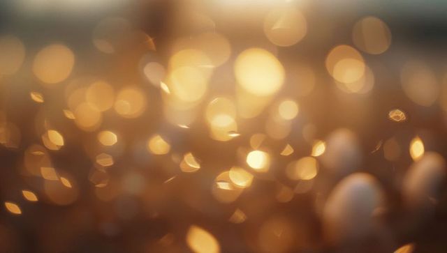 Warm golden bokeh with gleaming light orbs