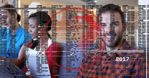 Smiling bearded man sitting with laptop in classroom, digital code overlay and timeline