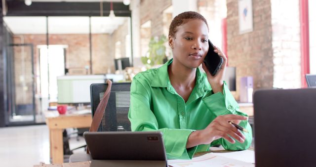 Young Professional Woman Working in Modern Office While on the Phone - Download Free Stock Images Pikwizard.com