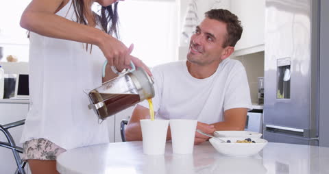 Couple Enjoying Morning Coffee and Breakfast at Home