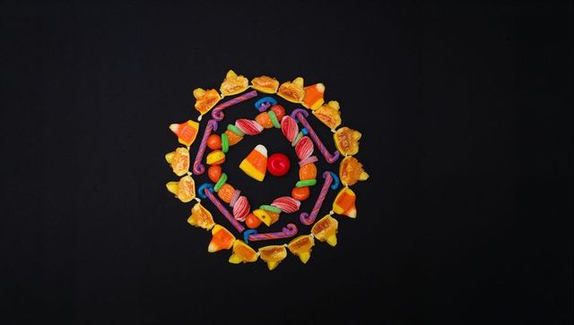 Colorful candy mandala on black background