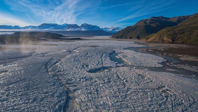 Vast fractured glacier with majestic snow-capped mountains