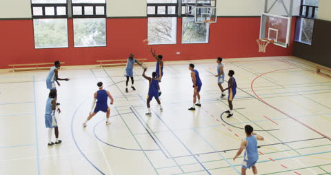 High School Basketball Game in Modern Gymnasium