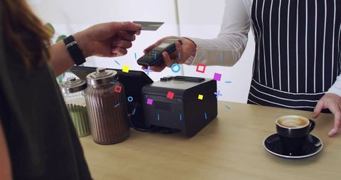 Contactless card payment at cafe counter with barista, receipt printer and latte