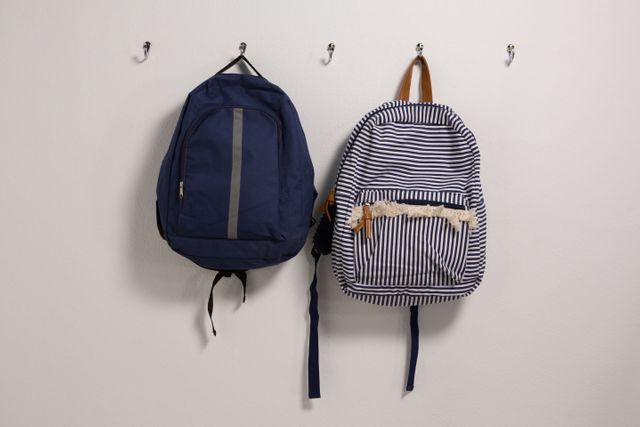 Schoolbags hanging on hook - Download Free Stock Photos Pikwizard.com