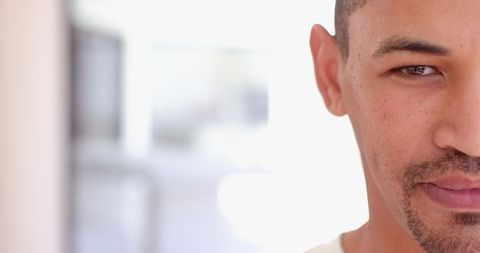 Focused portrait of man in modern minimalist interior
