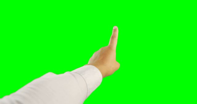 Hand pointing with index finger on a green screen background, suitable for business, technology, and touchscreen interface concepts. Perfect for presentations, advertisements, website images, and tutorials requiring a clear focus on hand gestures. Green screen background allows for easy editing and overlay of different scenes.
