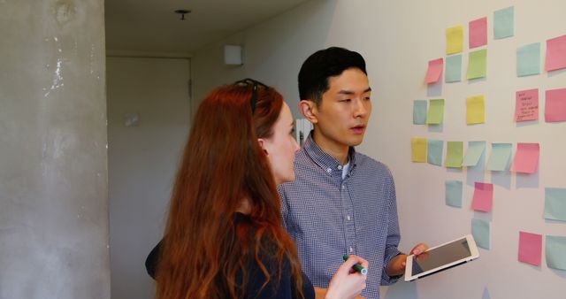 Two Colleagues Brainstorming in Modern Office with Sticky Notes - Download Free Stock Images Pikwizard.com