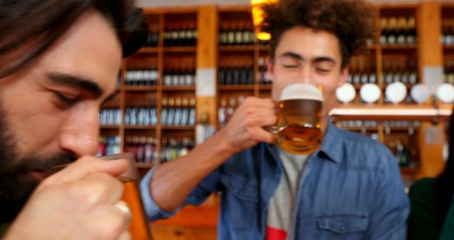 Friends Enjoying Beers in a Bar - Download Free Stock Images Pikwizard.com