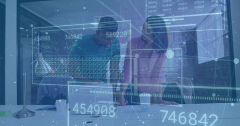 Professionals Analyzing Augmented Reality Data Panels in Modern Office