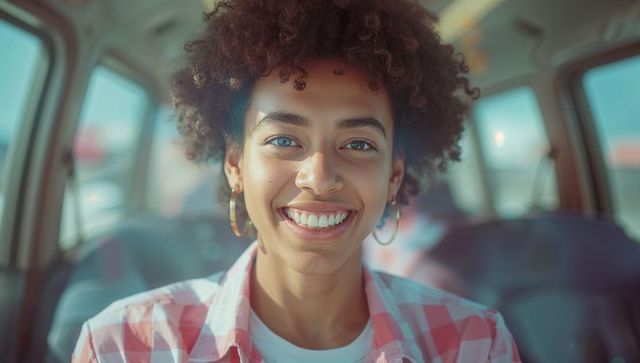 Smiling Woman Enjoying Joyful Ride in Background of Vehicle Interior