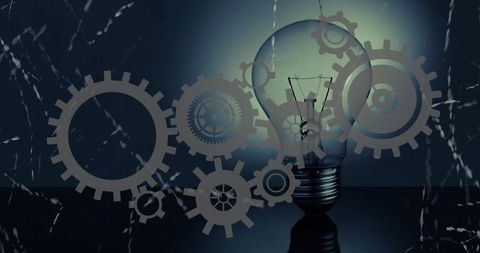 Glowing light bulb with gears overlay conveying innovation, technology, mechanical idea