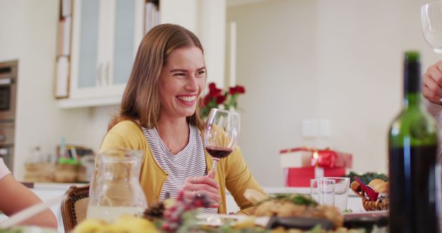 Smiling Woman Enjoying Wine at Dinner Party with Friends - Download Free Stock Images Pikwizard.com