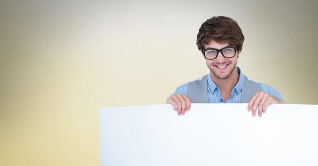 Happy Man with Glasses Holding Blank Billboard on Neutral Background - Download Free Stock Photos Pikwizard.com