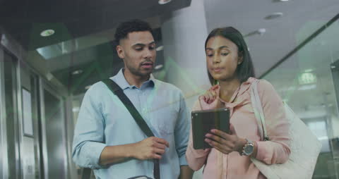 Diverse Colleagues Analyzing Digital Financial Charts in Modern Office