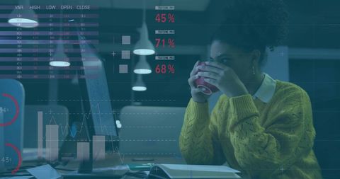 Businesswoman Analyzing Financial Data Late at Night