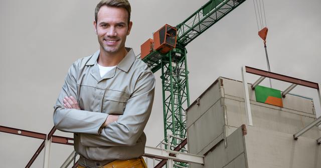 Digital composite image of handyman standing with arms crossed against construction site