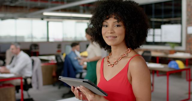 Confident Businesswoman in Modern Office Holding Tablet - Download Free Stock Images Pikwizard.com