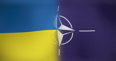 Blended flags of ukraine and nato symbolizing cooperation and support