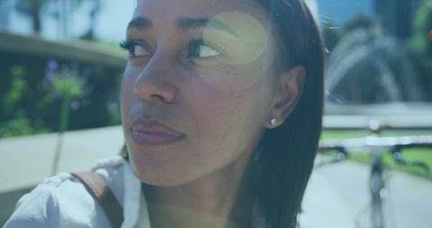 Contemplative Woman Enjoying a Sunny Day in the Park