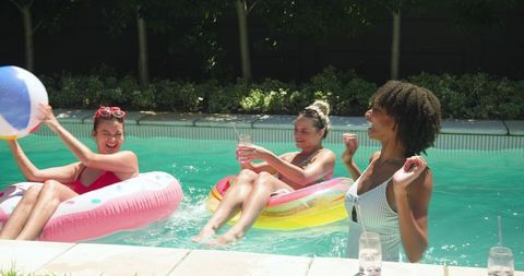 Friends Enjoying Summer Pool Day with Fun and Relaxation