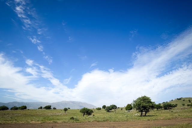 Beautiful Countryside Landscape with Blue Sky and Clouds - Download Free Stock Photos Pikwizard.com
