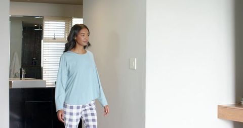 Casual Morning Routine by Bathroom in Minimalist Home