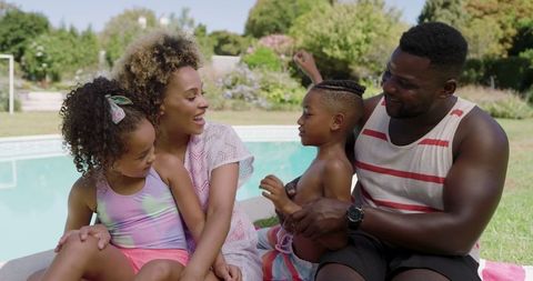 Family Bonding by Backyard Pool in Celebratory Summer Setting