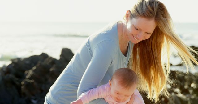 Mother Playing with Baby at Beach During Sunset - Download Free Stock Images Pikwizard.com