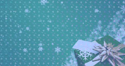 Festive Christmas Gift with Snowflake Design Background