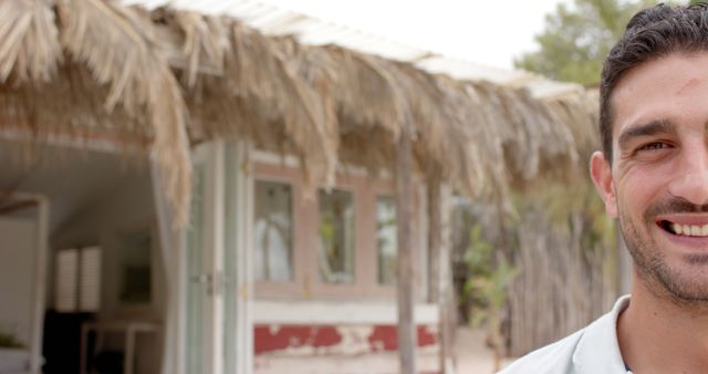 Smiling Man Outdoors Near Rustic Building - Download Free Stock Images Pikwizard.com