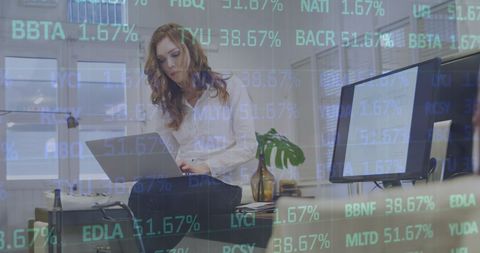 Businesswoman Analyzing Data with Financial Statistics Overlay