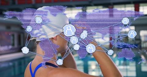 Swimmer adjusting goggles at indoor pool with holographic global network overlay