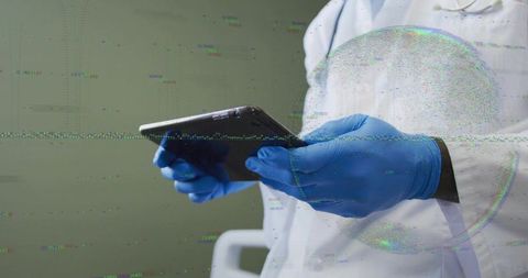 Doctor holding tablet with blue nitrile gloves checking clinic chart with glitch distortion, copy sp