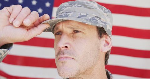 American Soldier Wearing Cap Saluting Patriotic Background