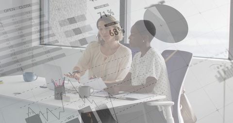 Diverse Businesswomen Collaborating with Data Analytics Overlay